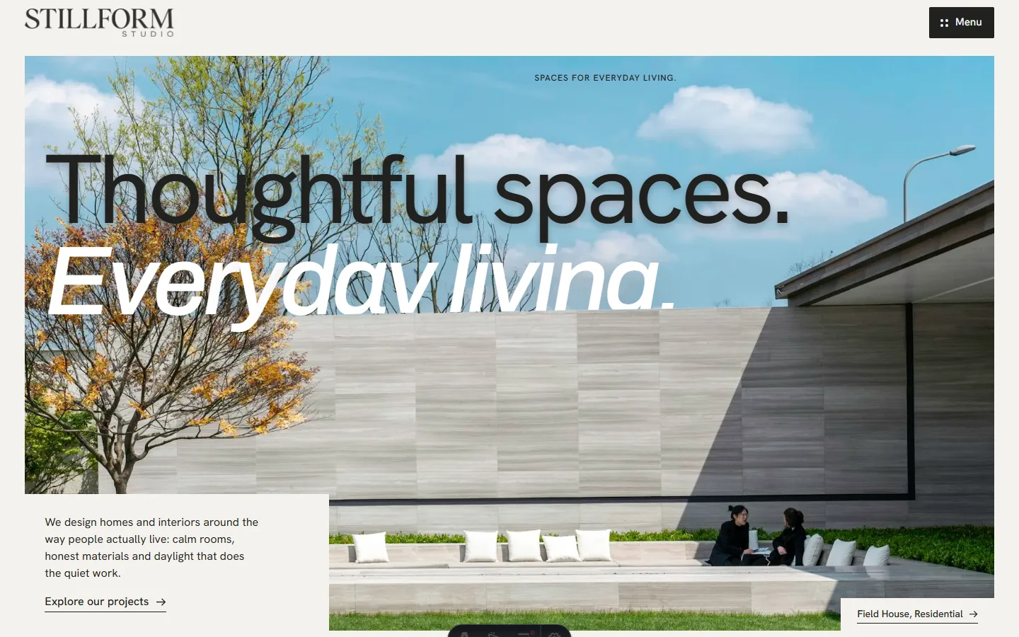 The Stillform Studio homepage: 'Thoughtful spaces. Everyday living.' over a photo of a stone courtyard wall with a seating terrace